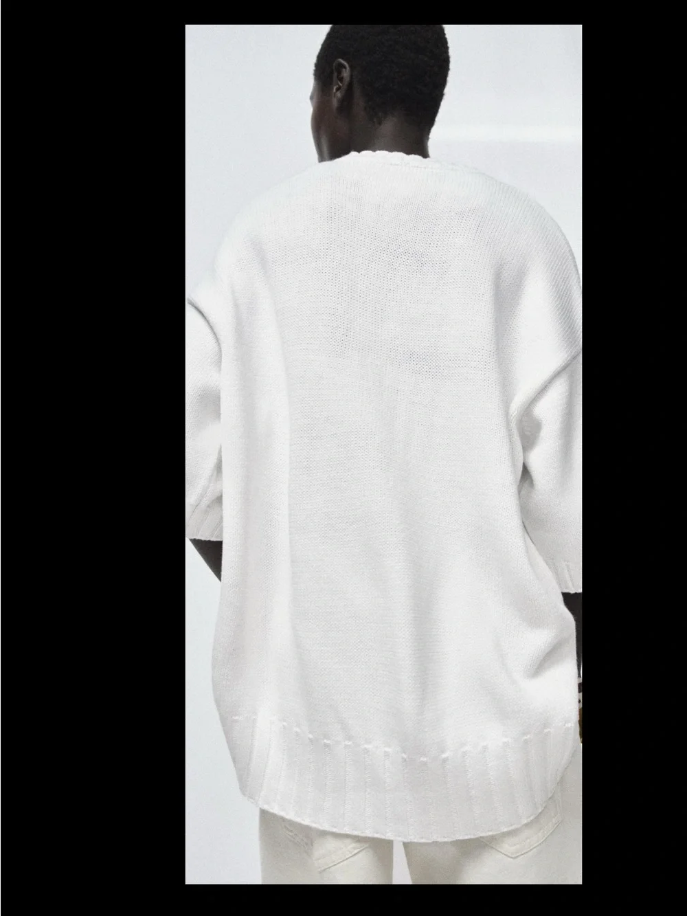 ZARA Loose-fit round neck short sleeve jumper with asymmetric hem.